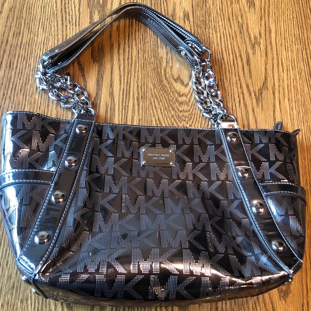 Authentic Michael Kors monogram metallic handbag with chain handles